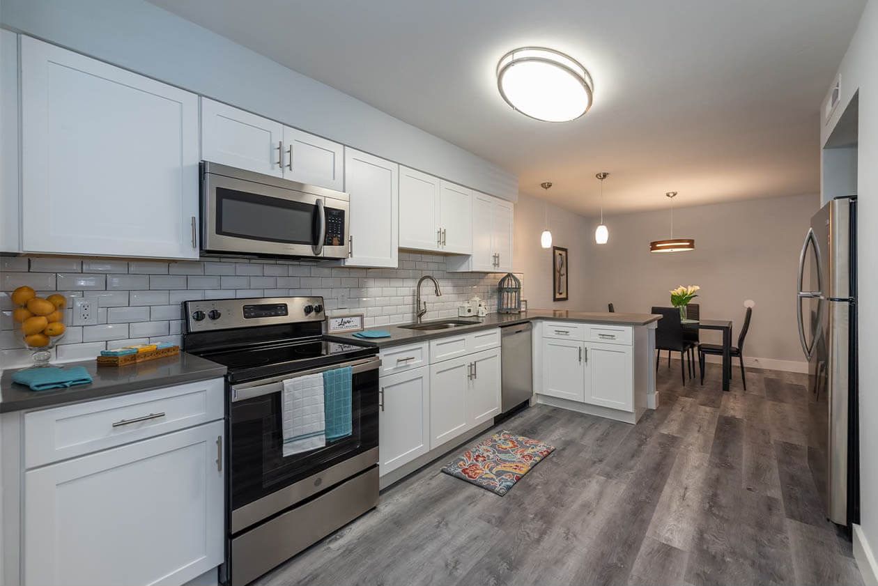 Arla renovated kitchen with white shaker cabinets