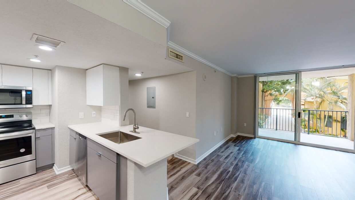 10X Mizner Park renovated two-bedroom kitchen and living area